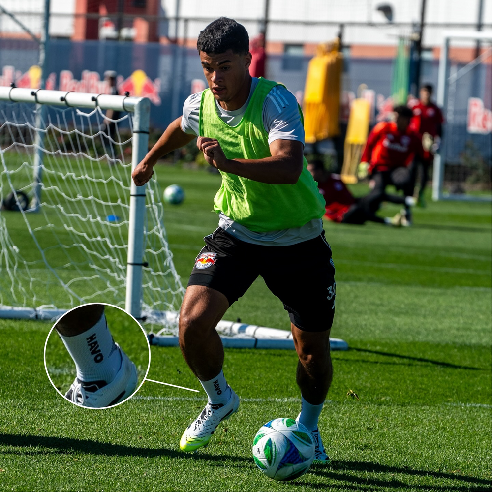 Pro soccer player with HAVO anti-slip grip socks showing improved ball control
